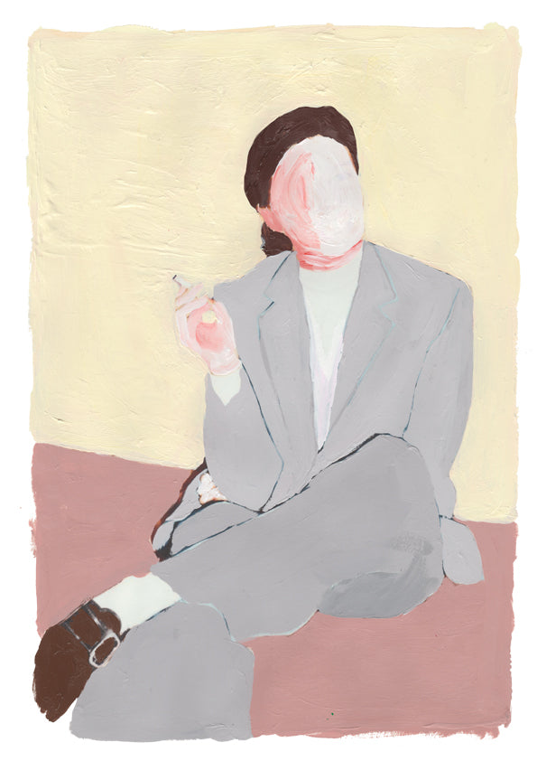 a man in a suit and tie sitting in a chair