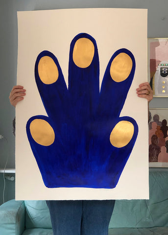 a close up of a person holding a pair of scissors