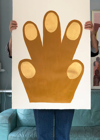 a person holding a large pair of scissors