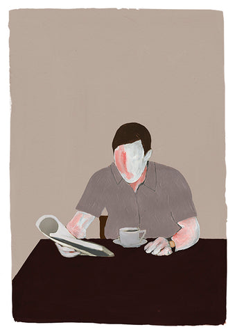 a man sitting in front of a laptop computer