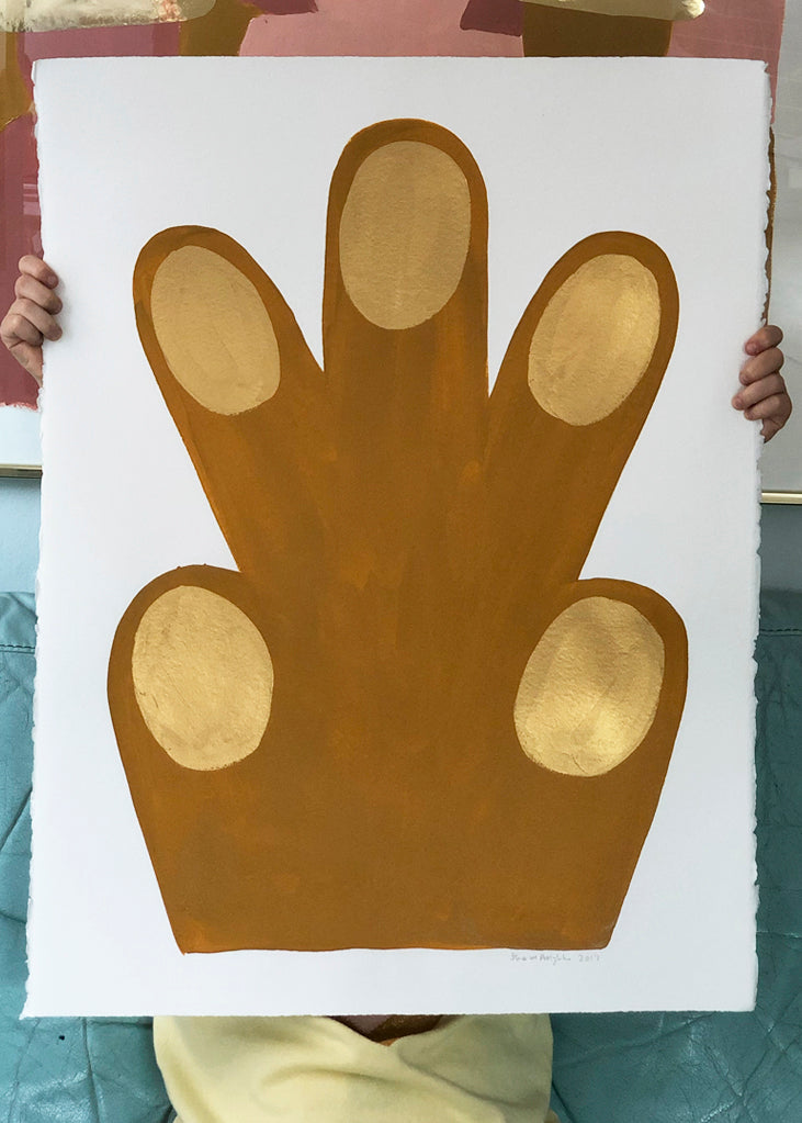 a close up of a person holding a pair of scissors