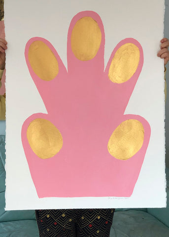 a pink umbrella is sitting on a table